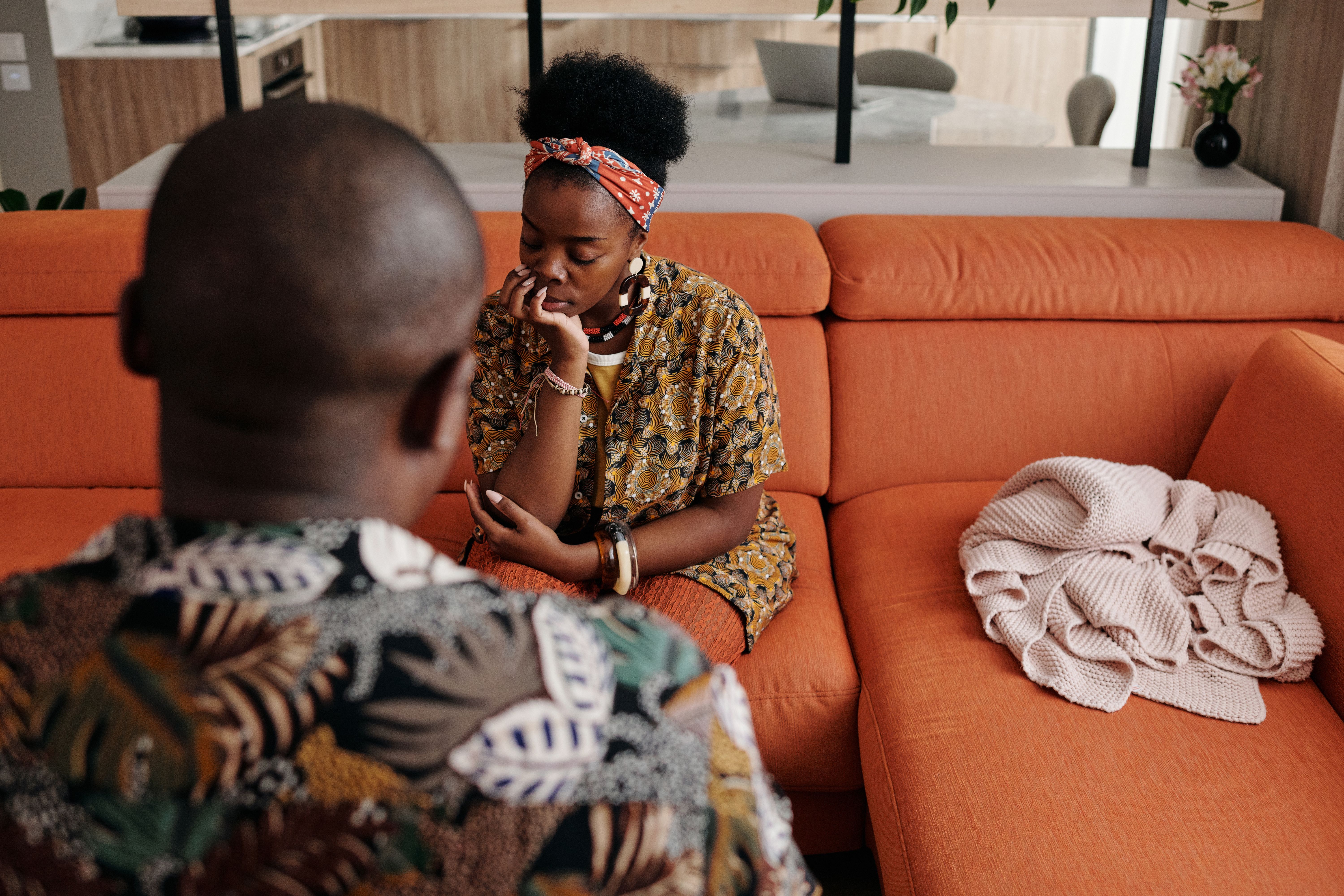 A married couple reconciling with a gentle gesture after a disagreement