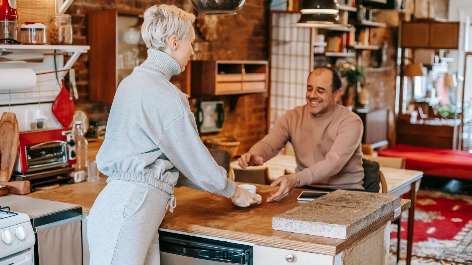 Two partners sharing a moment of love and appreciation at home